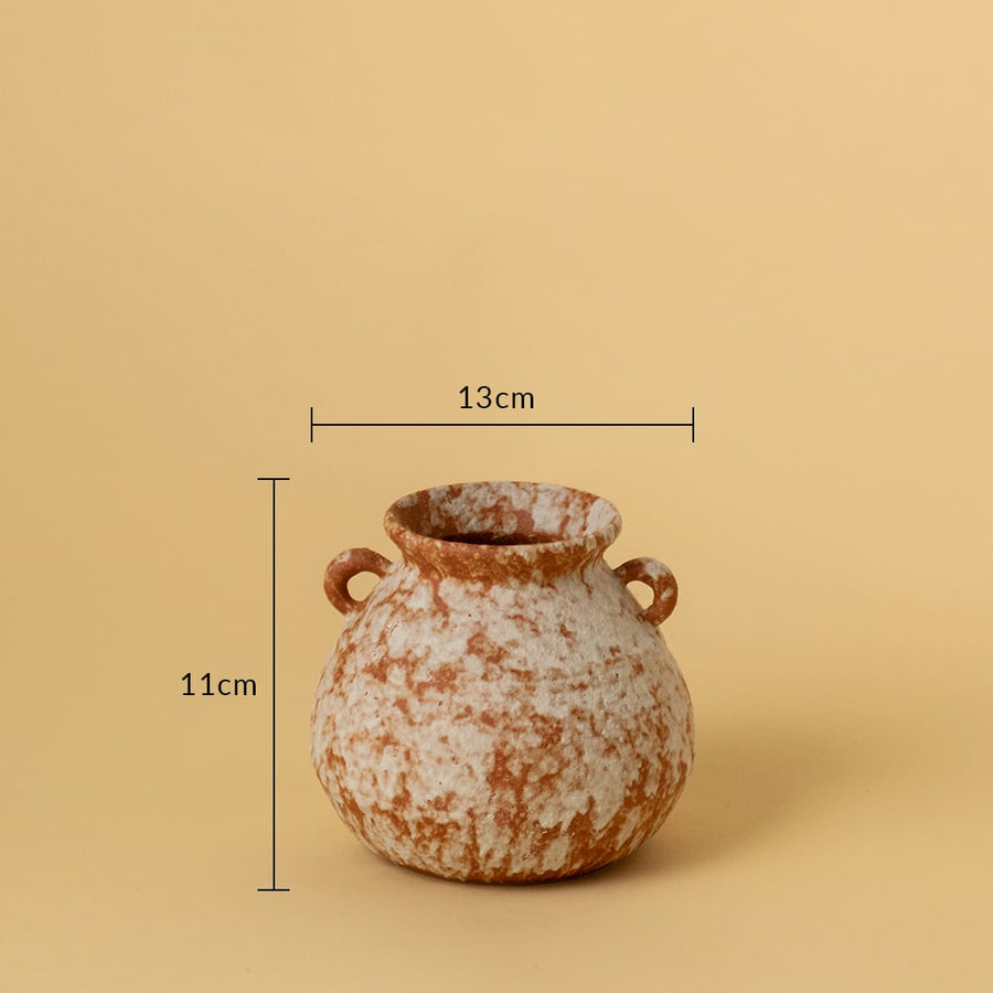 Small terracotta ceramic vase with dual side handles shown with 11cm height and 13cm width against beige background.