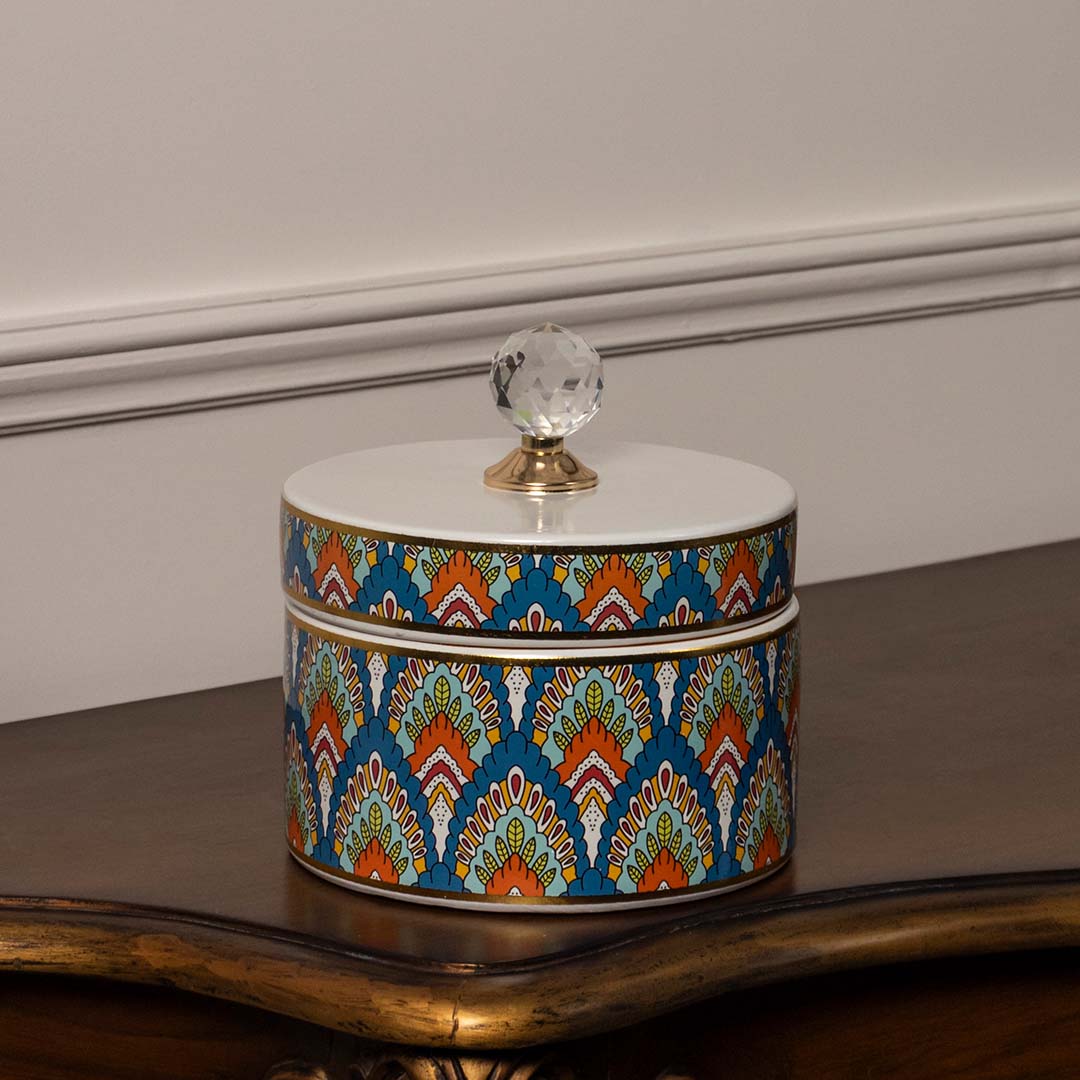 Round ceramic jar with multicolor geometric design and crystal knob lid perfect for modern luxury home interiors.
