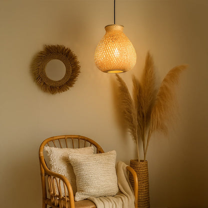 Woven rattan pendant light with bulbous shade styled in cozy interior above chair for natural home lighting.