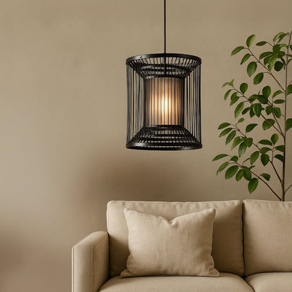 Cylindrical black wire pendant light adding a chic industrial touch and warm glow to elevate modern interior decor.