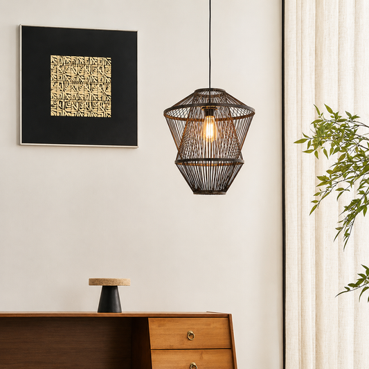 A dark brown woven pendant light hangs in a modern room setting next to a window with sheer curtains, with a wooden console table and framed wall art below.