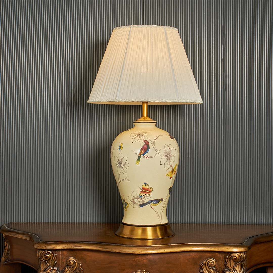 Ubayy ceramic table lamp displayed on black background showing smooth ceramic body soft glow and elegant design for bedside and table decor.