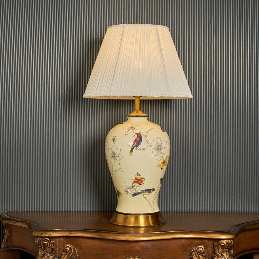 Ubayy ceramic table lamp displayed on black background showing smooth ceramic body soft glow and elegant design for bedside and table decor.
