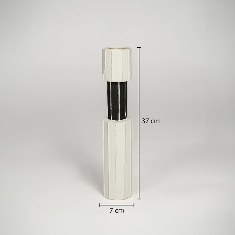 White metal and glass decorative candle holder measuring 37 cm height and 7 cm width ideal for modern table decor styling.