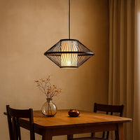 Geometric black metal pendant light creating warm contemporary lighting with elegant industrial appeal.