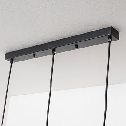 Close view of glossy gold silver and copper pendant shades highlighting their reflective metal finish and modern sculpted lighting design.