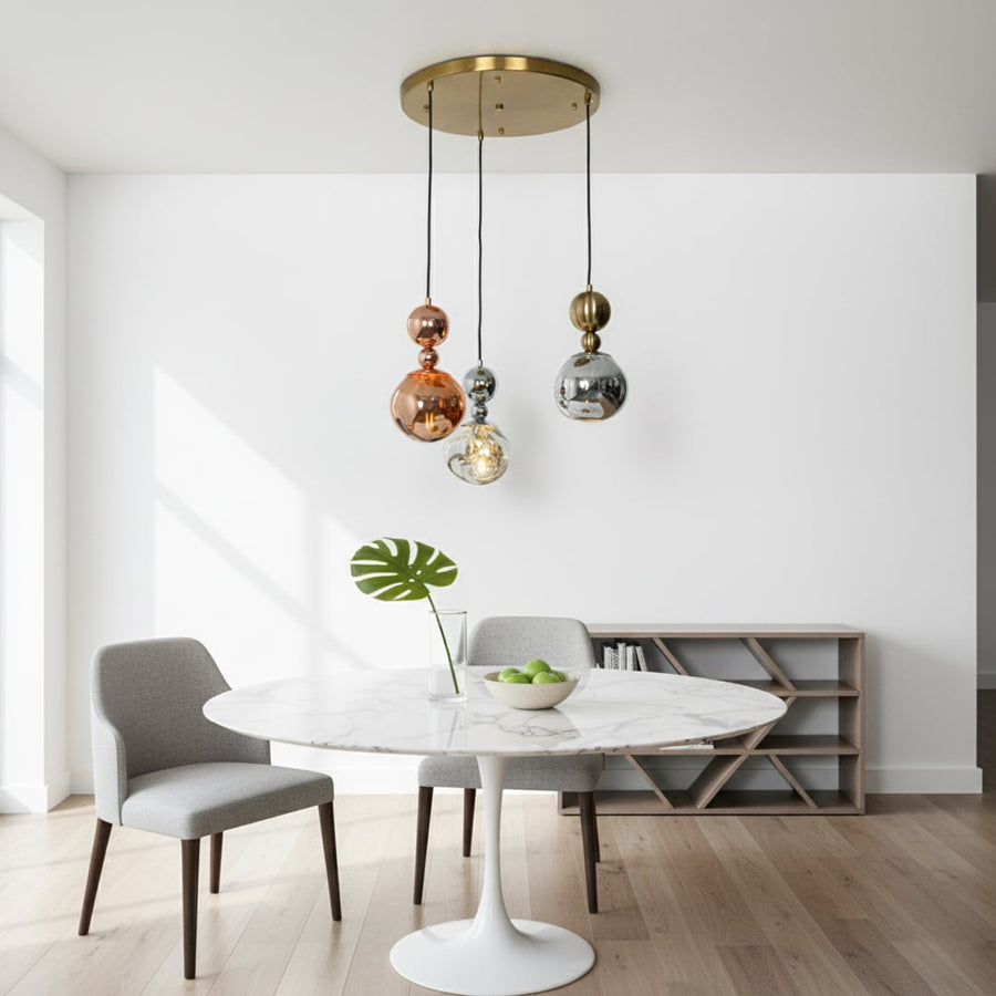 Gold chrome and copper cluster pendant lights hanging in a modern room adding a stylish decorative touch to contemporary interiors.