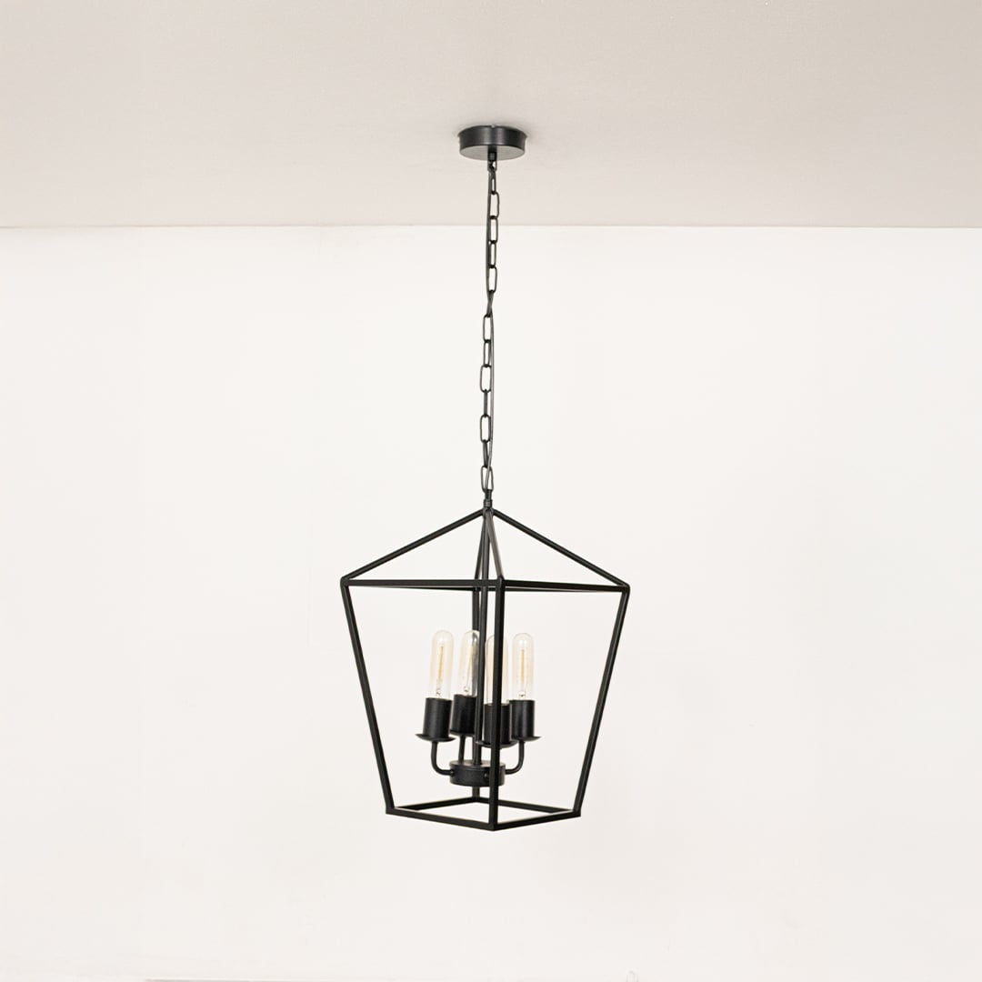 Black metal pendant light with clear glass bulbs displayed with lights off on a clean white background showcasing its sleek geometric frame.