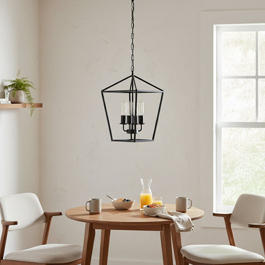 Modern black metal pendant light with clear glass bulbs hanging above a cozy dining setup creating warm ambient lighting in a contemporary home.