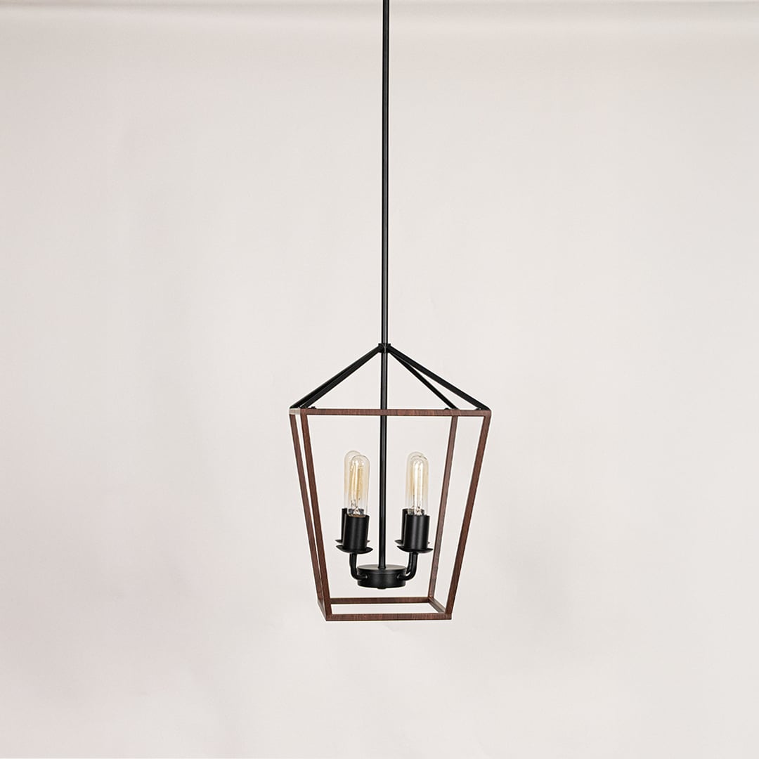 Black and wood pendant light with two clear glass bulbs displayed with lights off on a clean white background showcasing its modern geometric frame.
