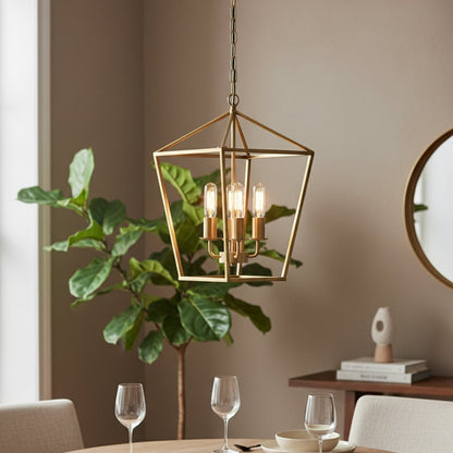 Gold metal pendant light with four clear bulbs hanging above a modern dining table creating a warm elegant and inviting interior atmosphere.