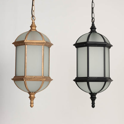 A grouped view of two outdoor lanterns turned off highlighting the difference between gold and black finishes along with their frosted glass bodies and traditional shapes.