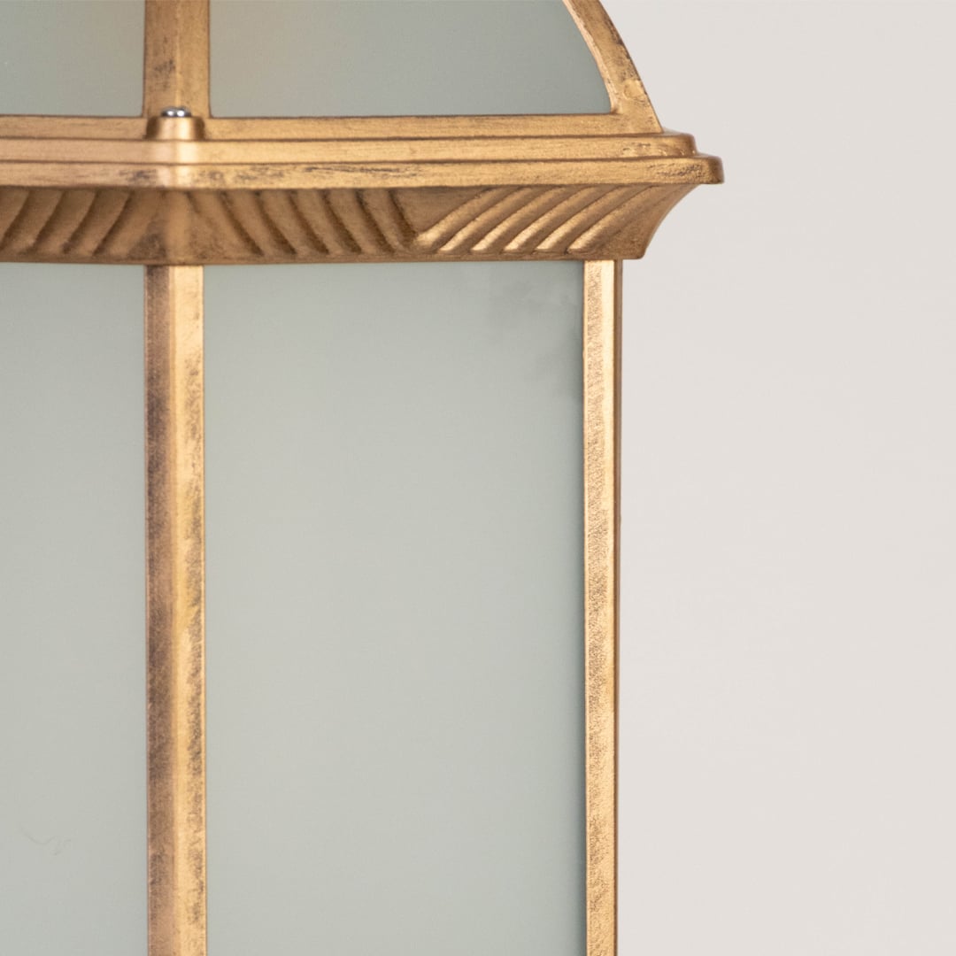 A closeup view of the hanging lantern showing the frosted glass panels detailed metal edging and smooth dome top capturing the vintage elegance of the design.