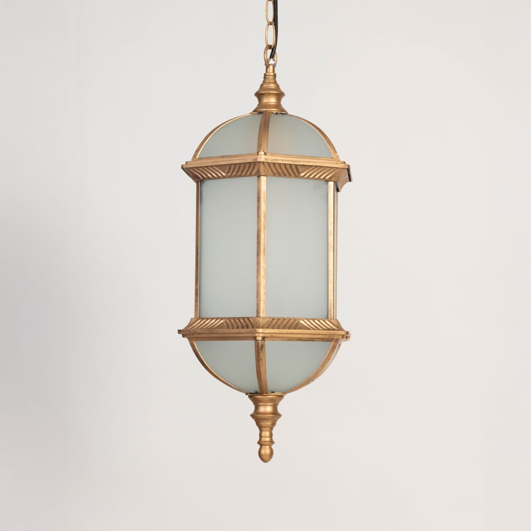 A golden hanging lantern with the light off displayed on a white background highlighting its frosted glass body detailed metal frame and traditional curved base design.
