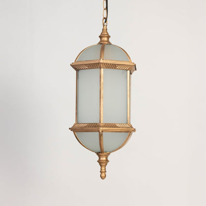 A golden hanging lantern with the light off displayed on a white background highlighting its frosted glass body detailed metal frame and traditional curved base design.