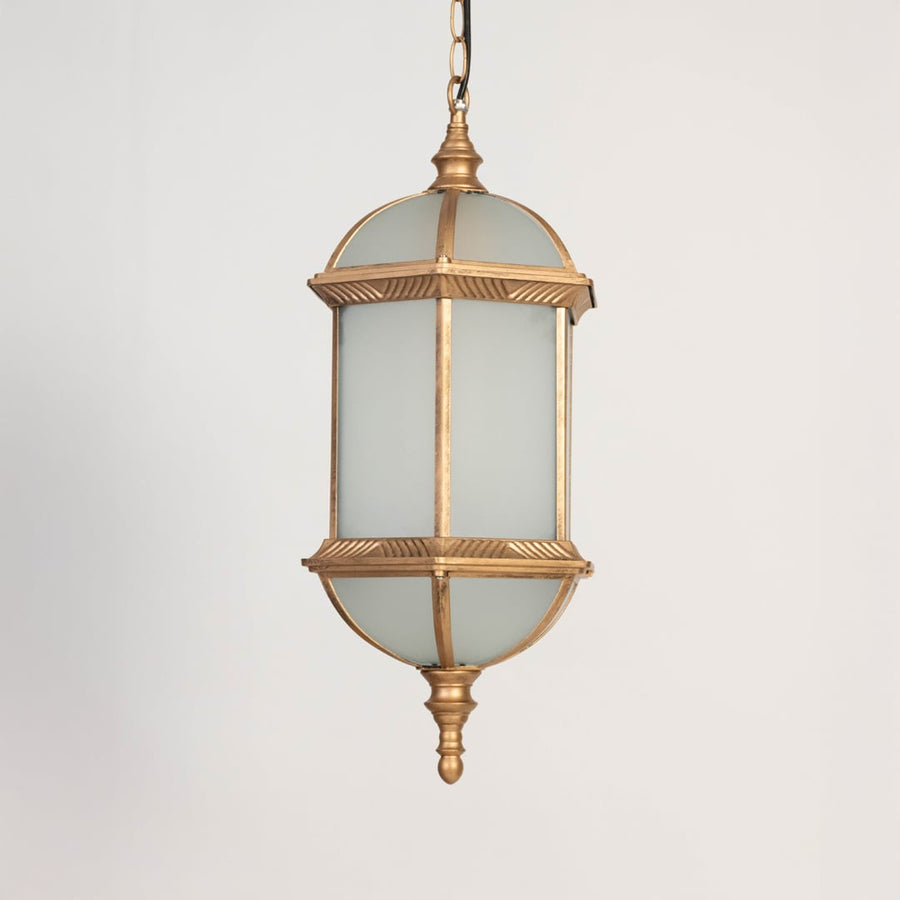 A golden hanging lantern with the light off displayed on a white background highlighting its frosted glass body detailed metal frame and traditional curved base design.