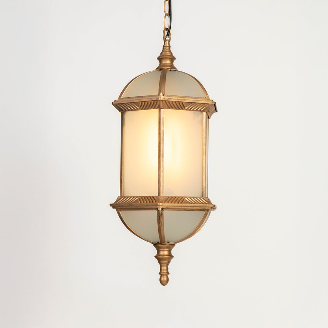 Closeup of gold metal outdoor lantern with glass panels on white background ideal for premium exterior decor lighting.