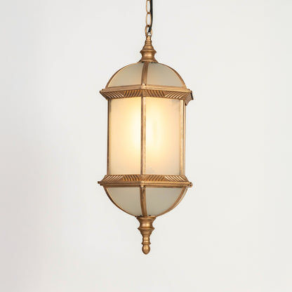 Closeup of gold metal outdoor lantern with glass panels on white background ideal for premium exterior decor lighting.