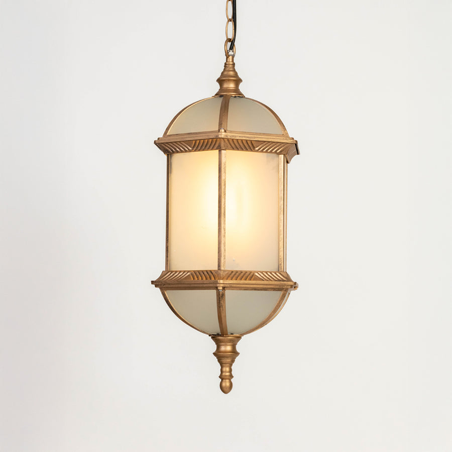 Closeup of gold metal outdoor lantern with glass panels on white background ideal for premium exterior decor lighting.