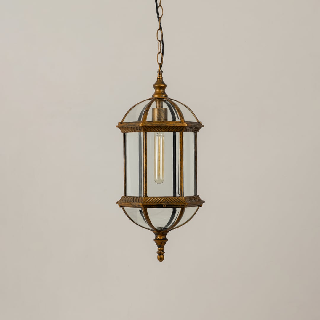 A classic bronze hanging lantern shown on a white background with the light off emphasizing its glass chamber metal frame and decorative vintage inspired structure.