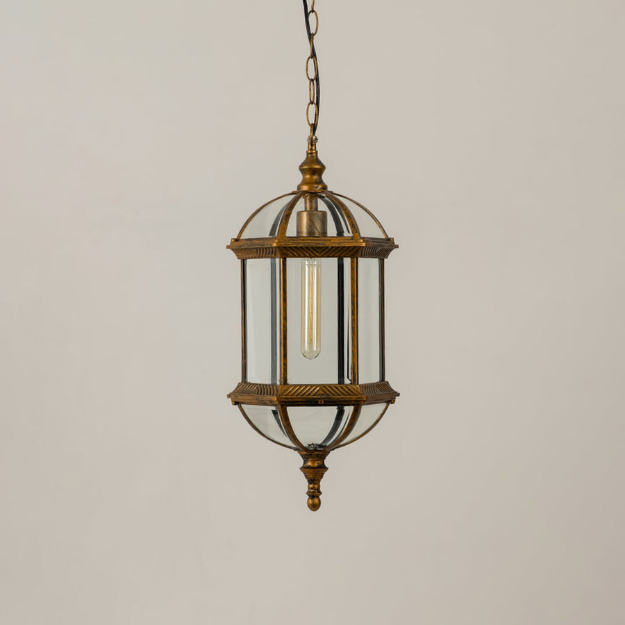 A classic bronze hanging lantern shown on a white background with the light off emphasizing its glass chamber metal frame and decorative vintage inspired structure.