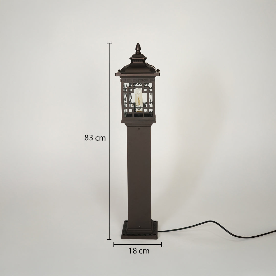 Traditional outdoor pillar lamp with dark metal finish and decorative glass housing on neutral background 83 cm height 18 cm width ideal for exterior garden lighting.

