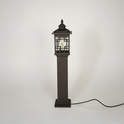 Traditional outdoor pathway light with decorative lantern top and black metal body on clean background ideal for exterior lighting setup.
