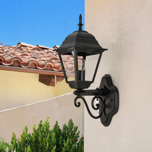 Black metal outdoor lantern wall light lifestyle image with decorative mount for stylish exterior wall decor.