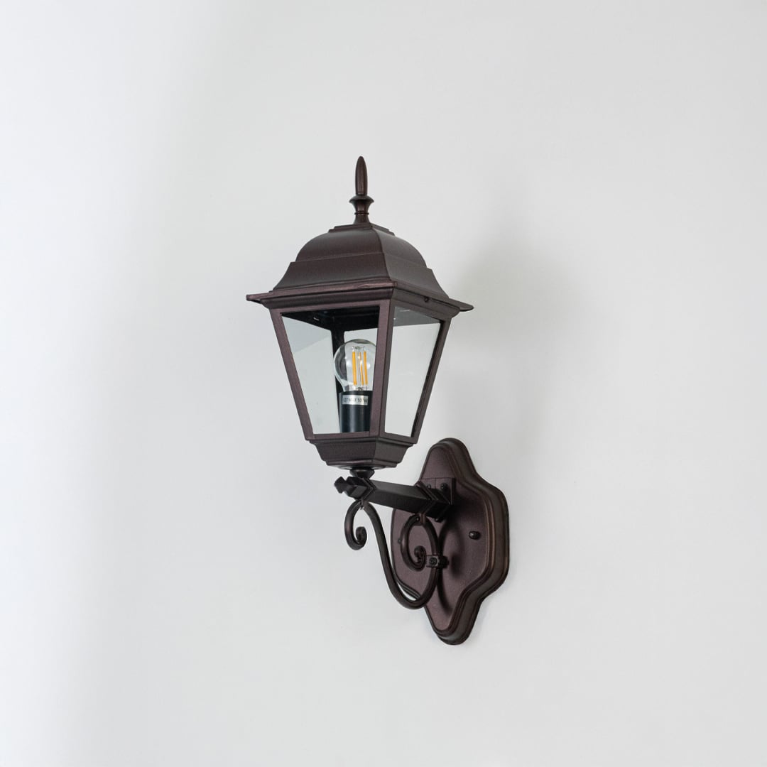 Black metal outdoor wall mounted lantern turned off on white background suitable for porch boundary wall and exterior Decor.