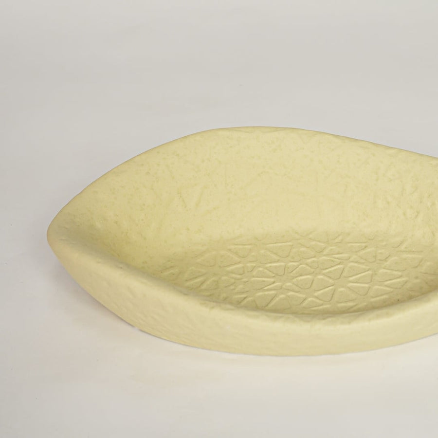Light yellow ceramic decorative bowl with detailed textured surface perfect for elegant dining table centerpiece and interior decor.