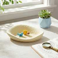 Light yellow ceramic decorative serving bowl with textured surface perfect for fruit display on dining table centerpiece and home decor.