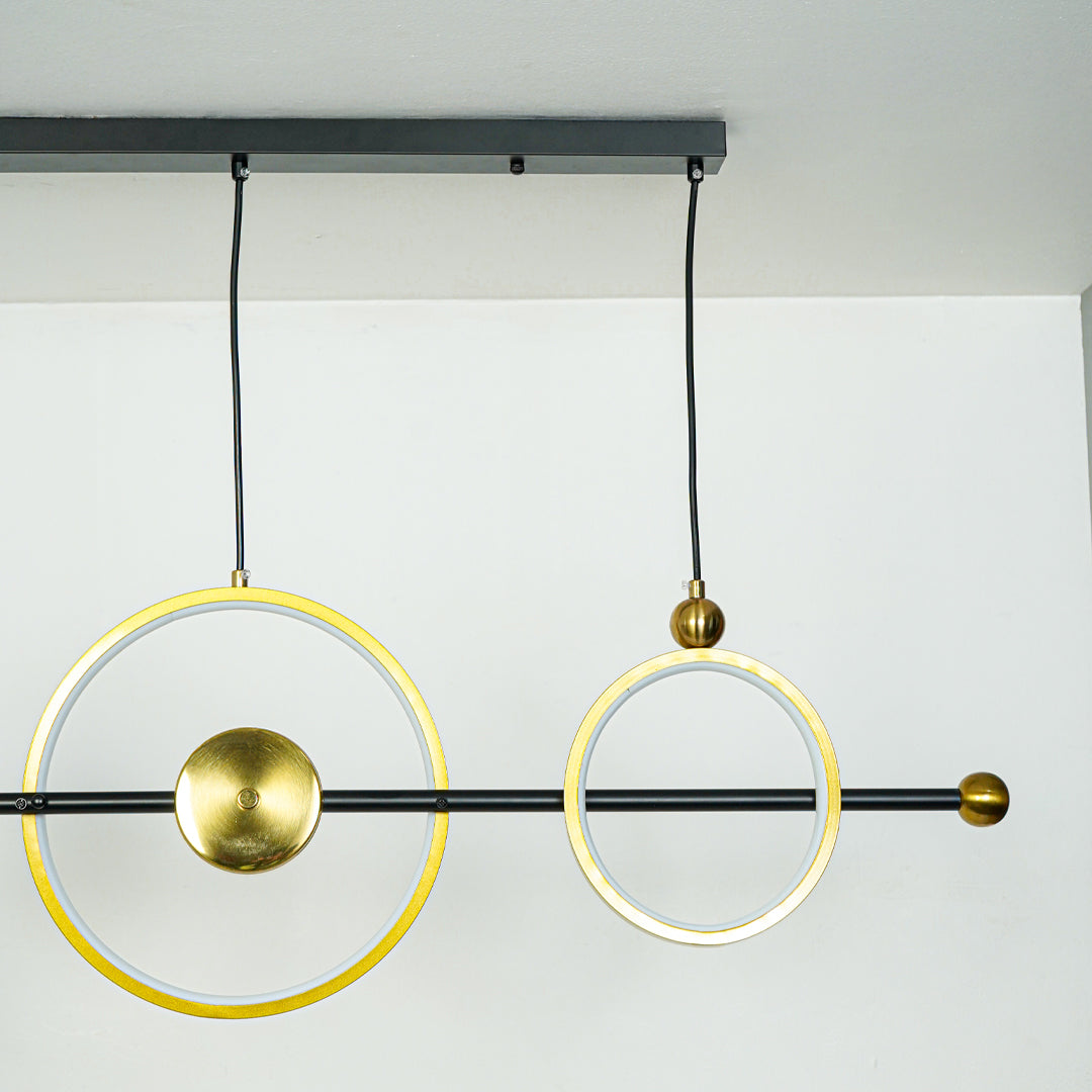 Minimal hanging pendant light with dual gold circular rings and white globe shade on clean background perfect for modern home decor lighting.