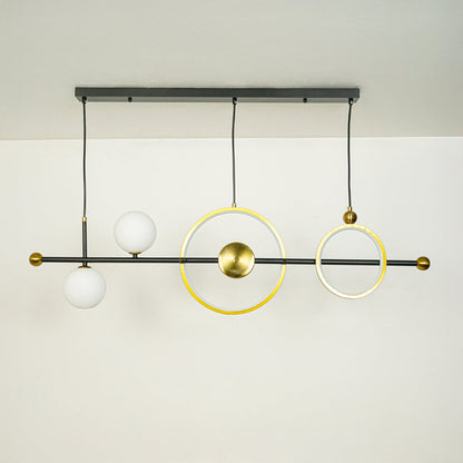 Contemporary linear chandelier with gold ring design and white glass globe mounted on black rod ideal for stylish dining or kitchen lighting.
