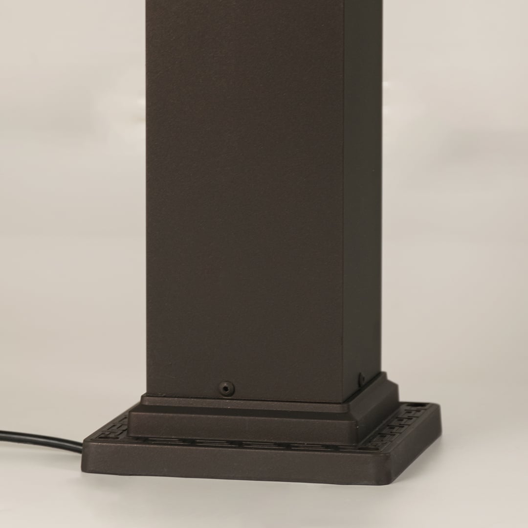 Closeup of black outdoor gate light base with modern metal finish for elegant exterior decor styling.