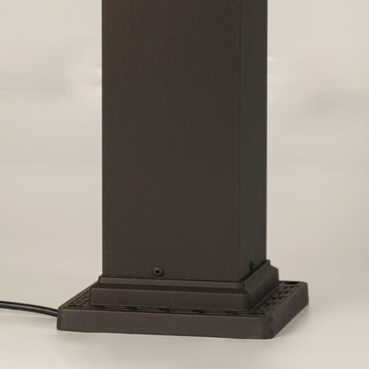 Closeup of black outdoor gate light base with modern metal finish for elegant exterior decor styling.