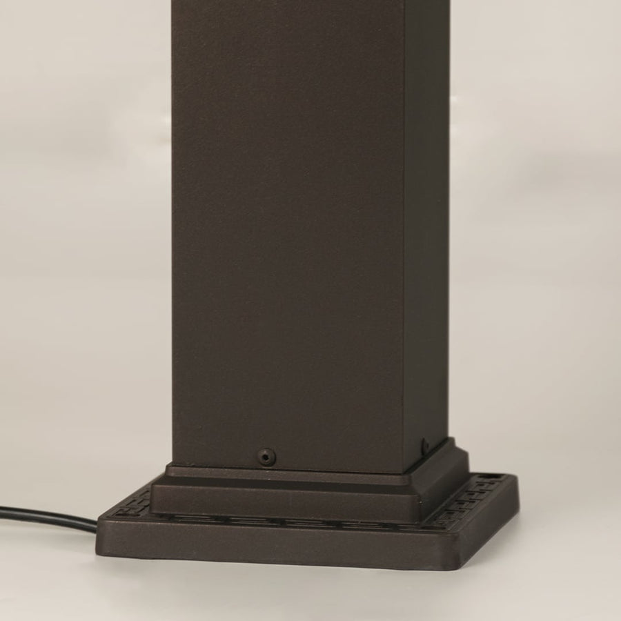 Closeup of black outdoor gate light base with modern metal finish for elegant exterior decor styling.