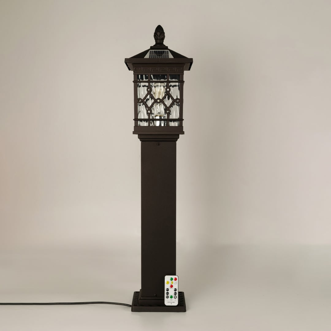 Vintage black solar outdoor gate light with geometric panels for elegant decor use.