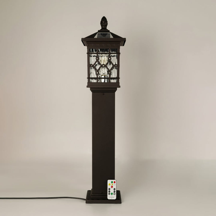 Vintage black solar outdoor gate light with geometric panels for elegant decor use.