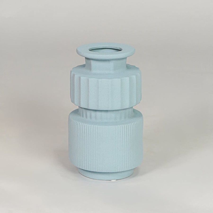 Light blue ceramic decorative vase isolated on white background modern flower vase for living room table decor styling.
