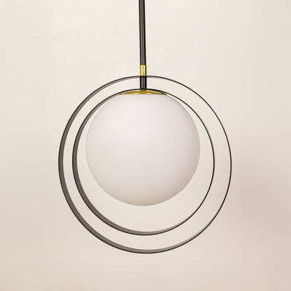 Modern circular ring pendant closeup showing white diffuser and slim gold frame for contemporary ambient ceiling lighting design.