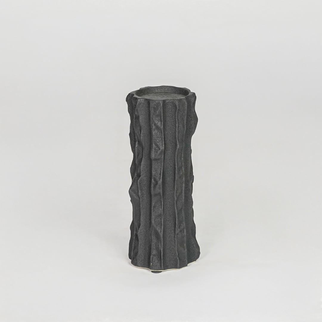 Modern black decorative candle holder isolated clean background stylish ceramic candle stand for home decor accent.