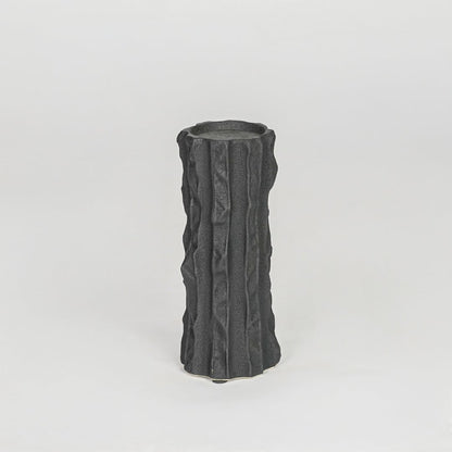 Modern black decorative candle holder isolated clean background stylish ceramic candle stand for home decor accent.