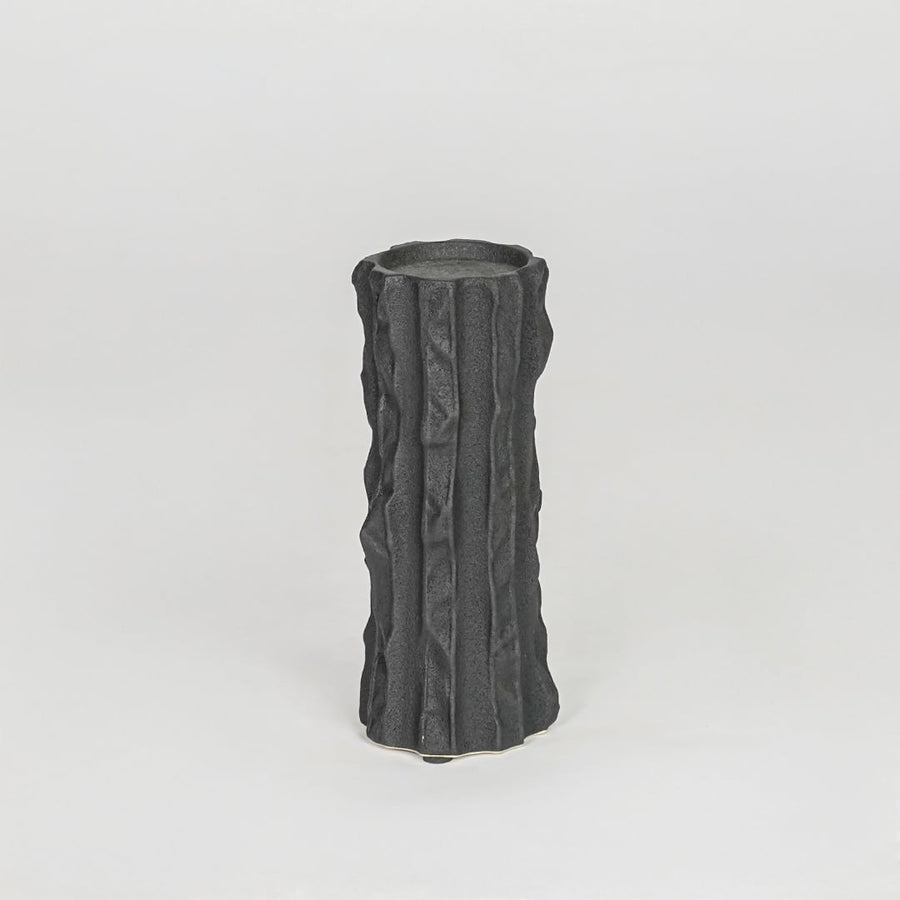 Modern black decorative candle holder isolated clean background stylish ceramic candle stand for home decor accent.