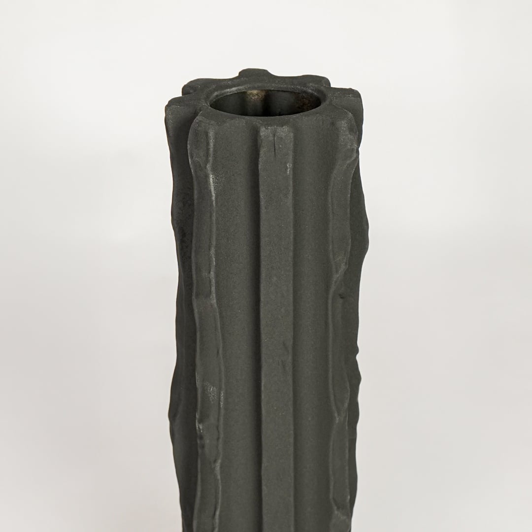 Black ceramic decorative vase with sculpted fluted texture perfect for elegant dried floral display and modern interior decor styling.