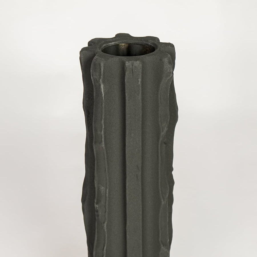 Black ceramic decorative vase with sculpted fluted texture perfect for elegant dried floral display and modern interior decor styling.