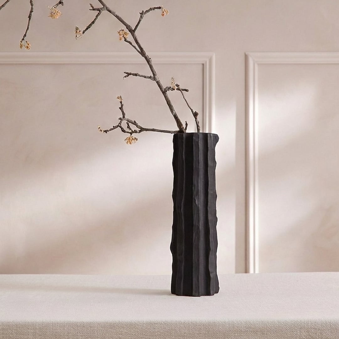 Black ceramic decorative floor vase with tall sculpted fluted design perfect for dried flower display in living room corner and modern home decor.