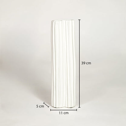 Dimension image of tall matte white ribbed ceramic cylinder vase with vertical fluting showing 39 cm height and 11 cm width.