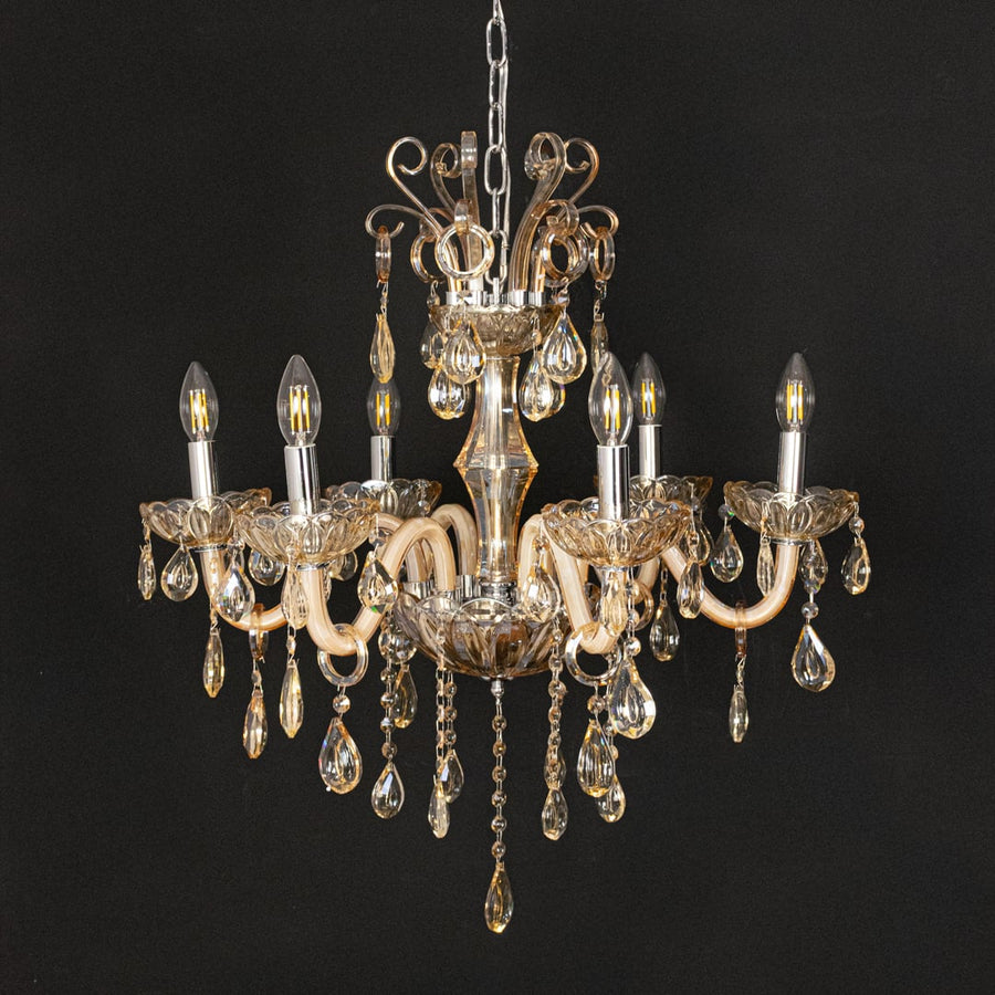 Golden crystal chandelier shown on black background highlighting premium detailing for elegant modern interiors.