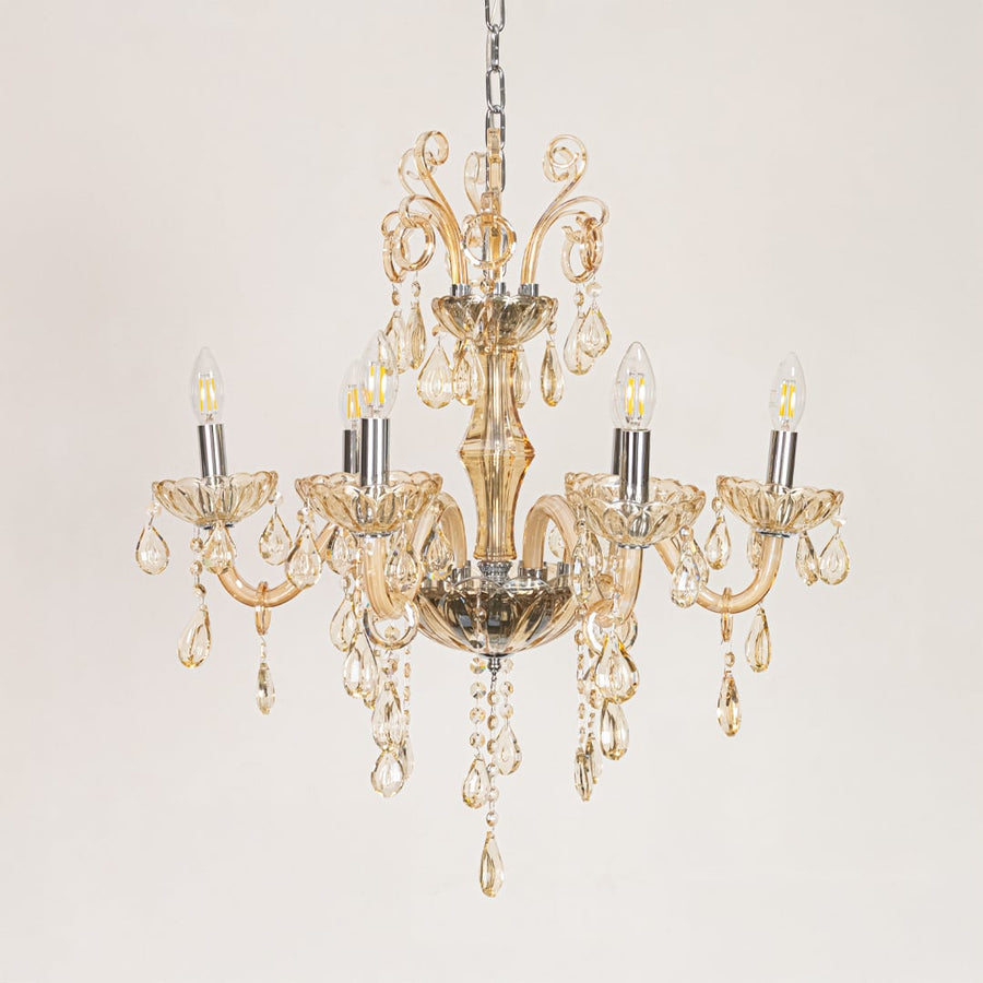 Golden crystal chandelier displayed on white background ideal for classic warm interior ceiling styling.