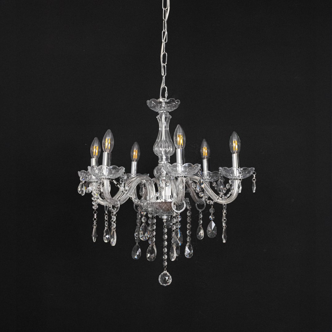 Crystal chandelier with lights off featuring decorative glass body and crystal hanging drops on black background.